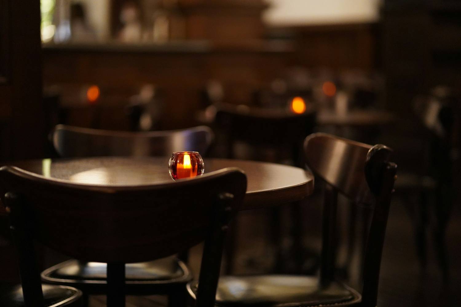 A warm, candle-lit dining setting